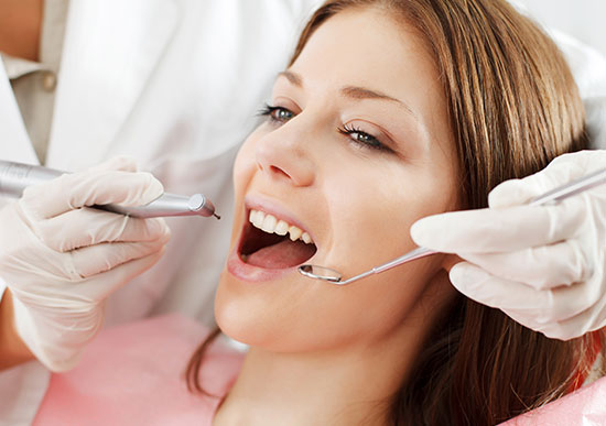 blonde woman on dental cleaning